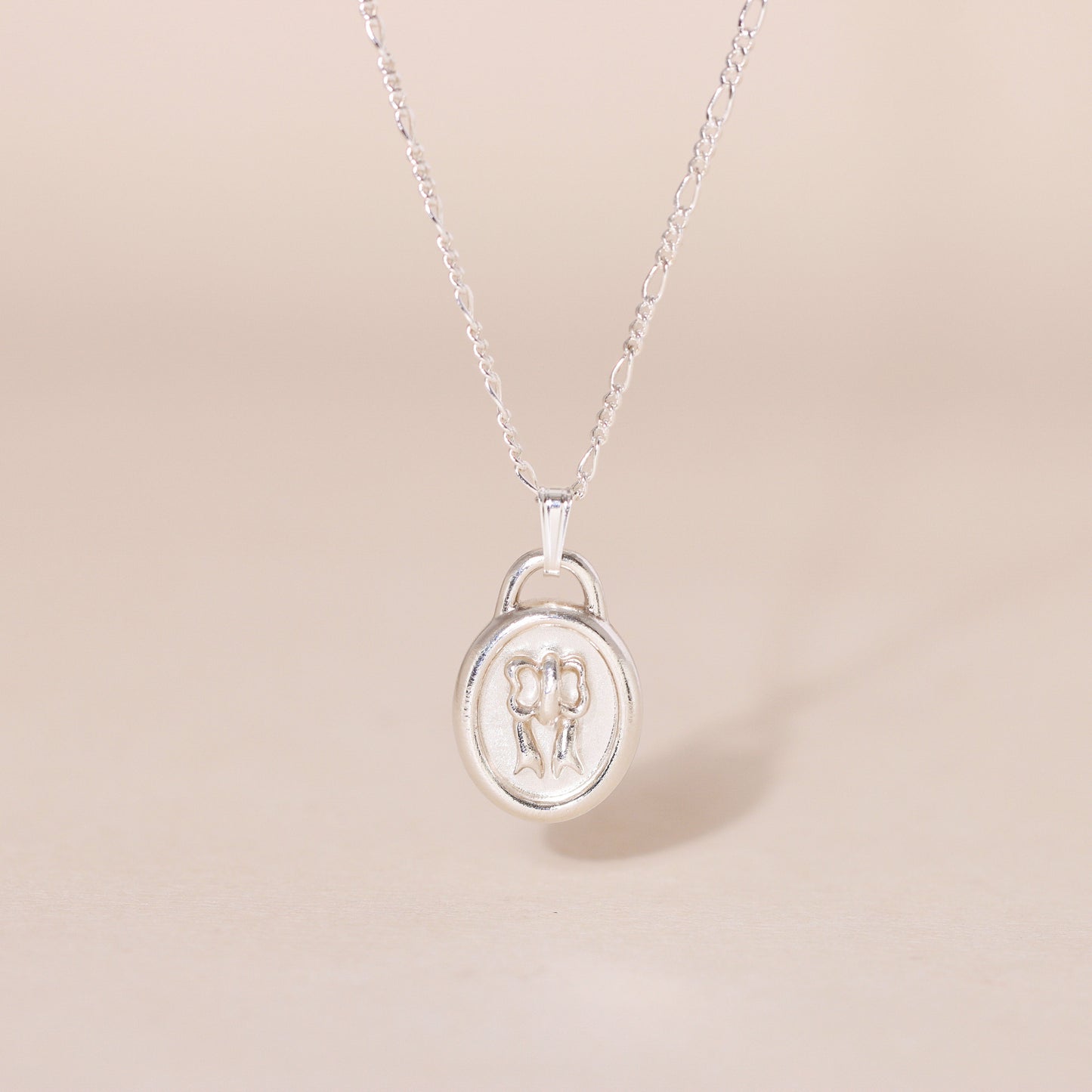 Sweet Oval-Framed Bow Charm Necklace
