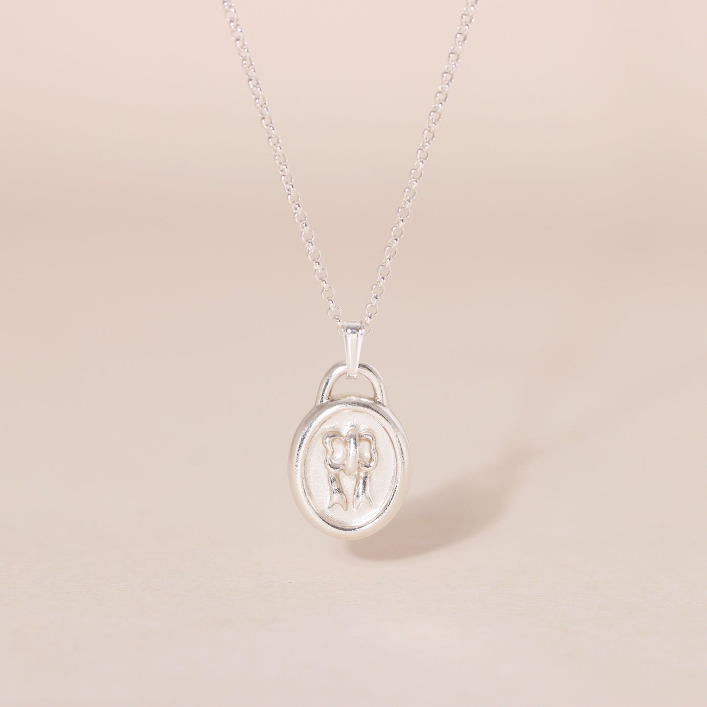 Sweet Oval-Framed Bow Charm Necklace